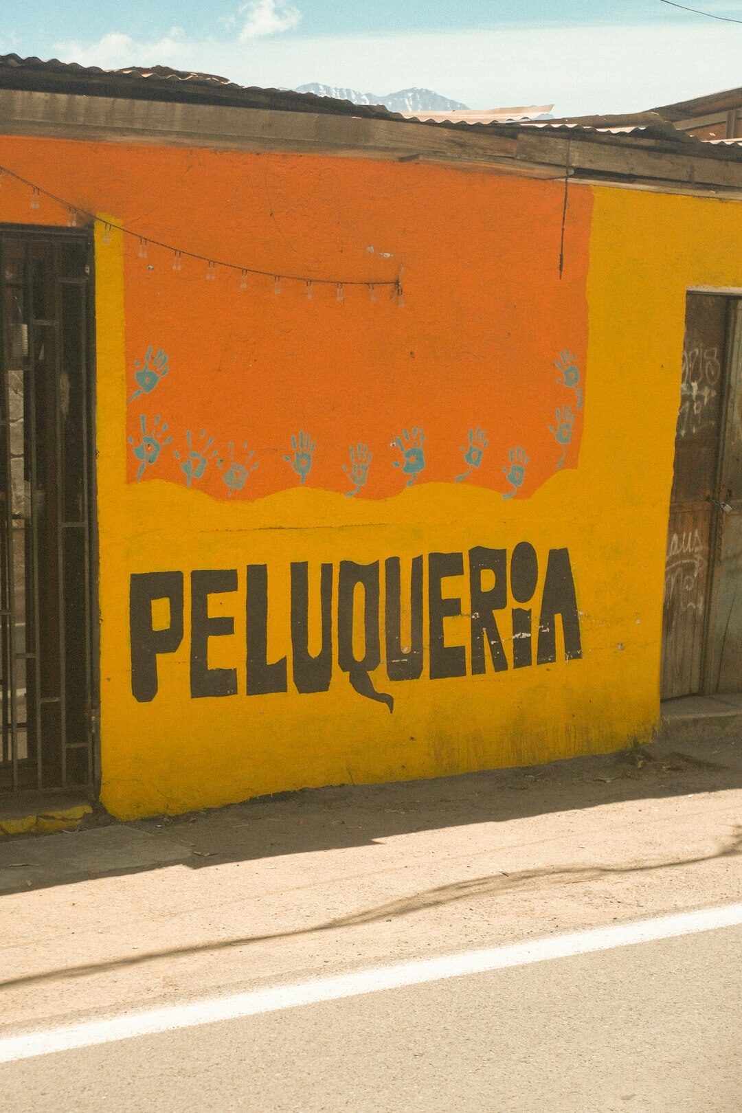Large colorful street art mural on an urban wall in Chile