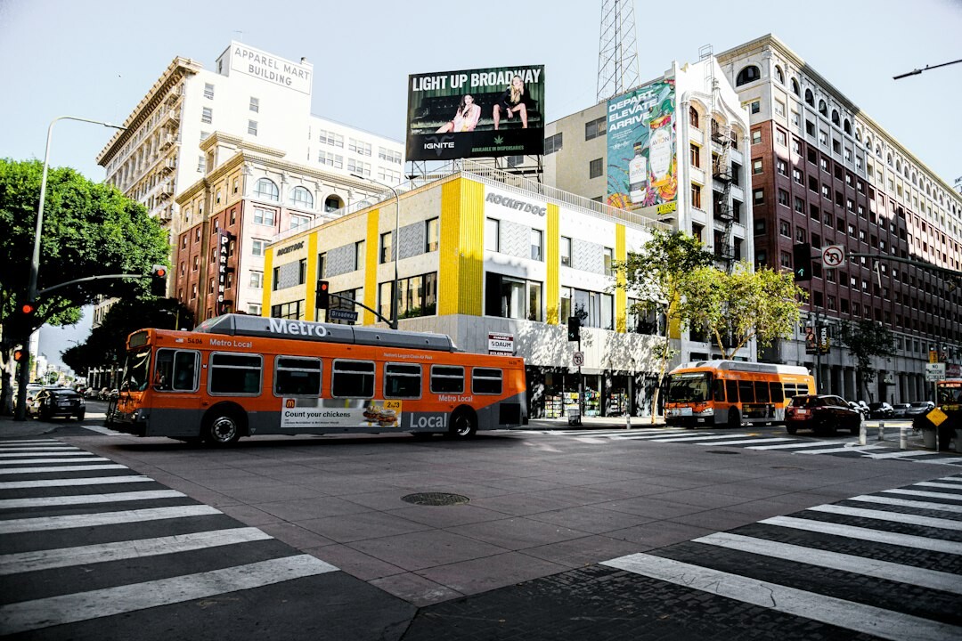 Public bus and pedestrians on a busy Chilean city avenue